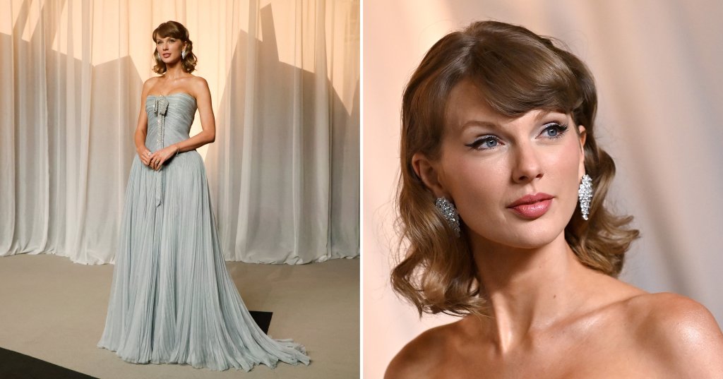 Taylor Swift in a strapless pleated silver-grey gown with a crystal bow, posing in front of draped white fabric backdrop.